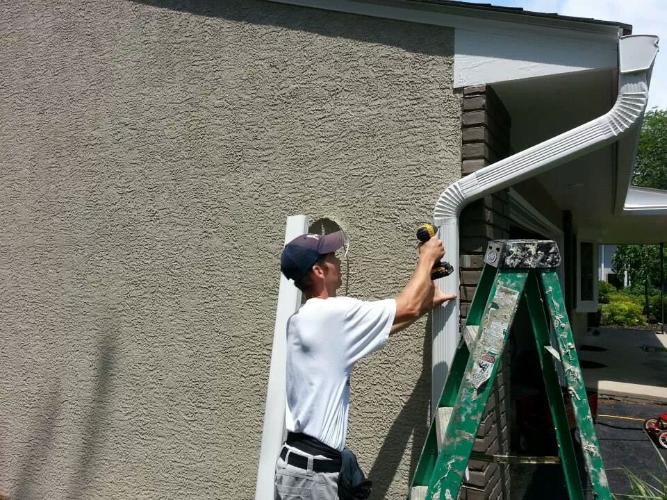 Color World employee installing gutter in Austin TX